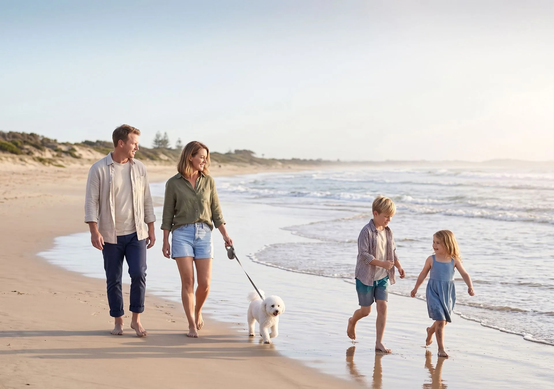 Young family relaxing together at the beach